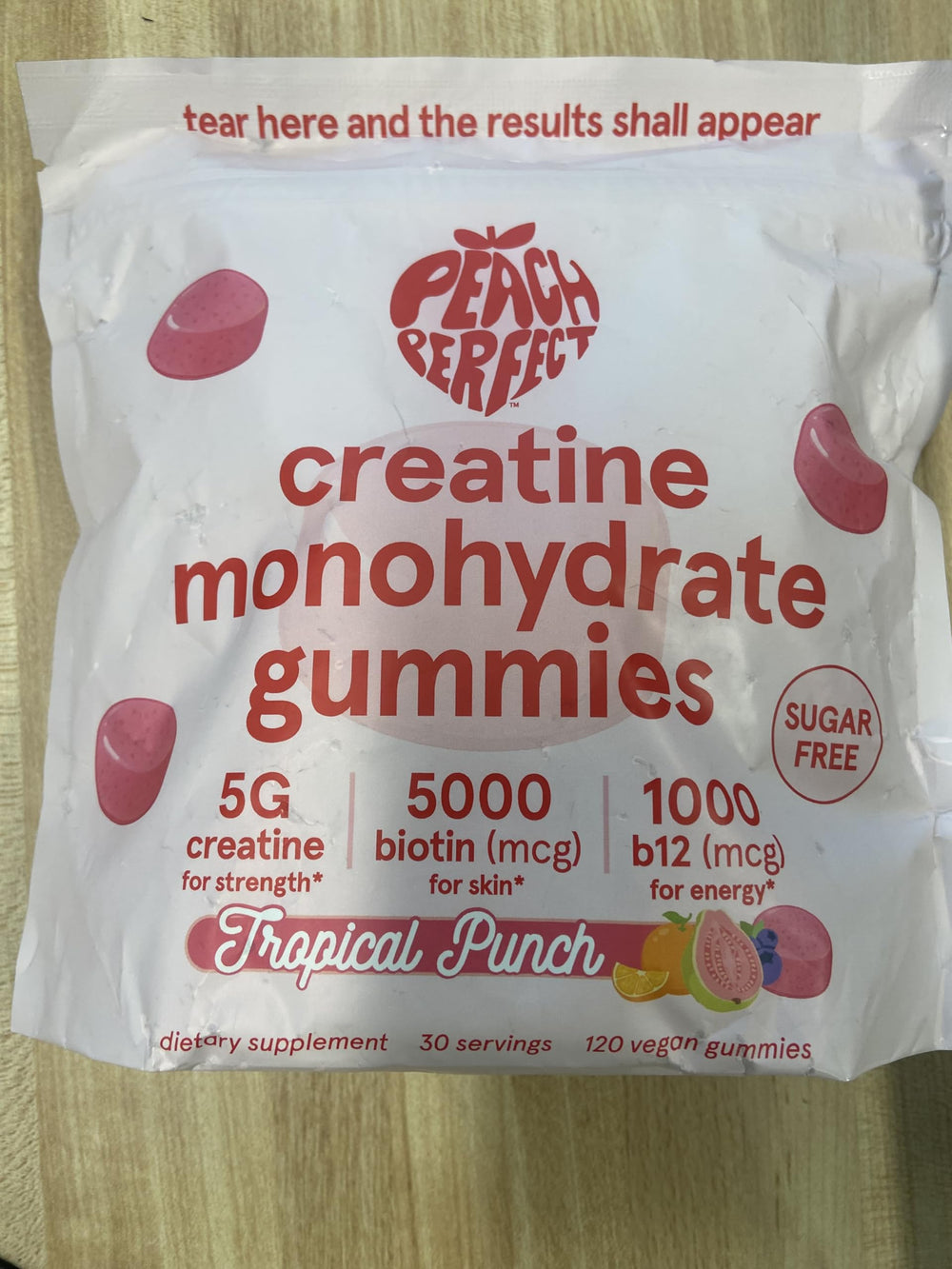 Bottle showing 5g creatine monohydrate per serving with 5000mcg biotin and 1000mcg B12