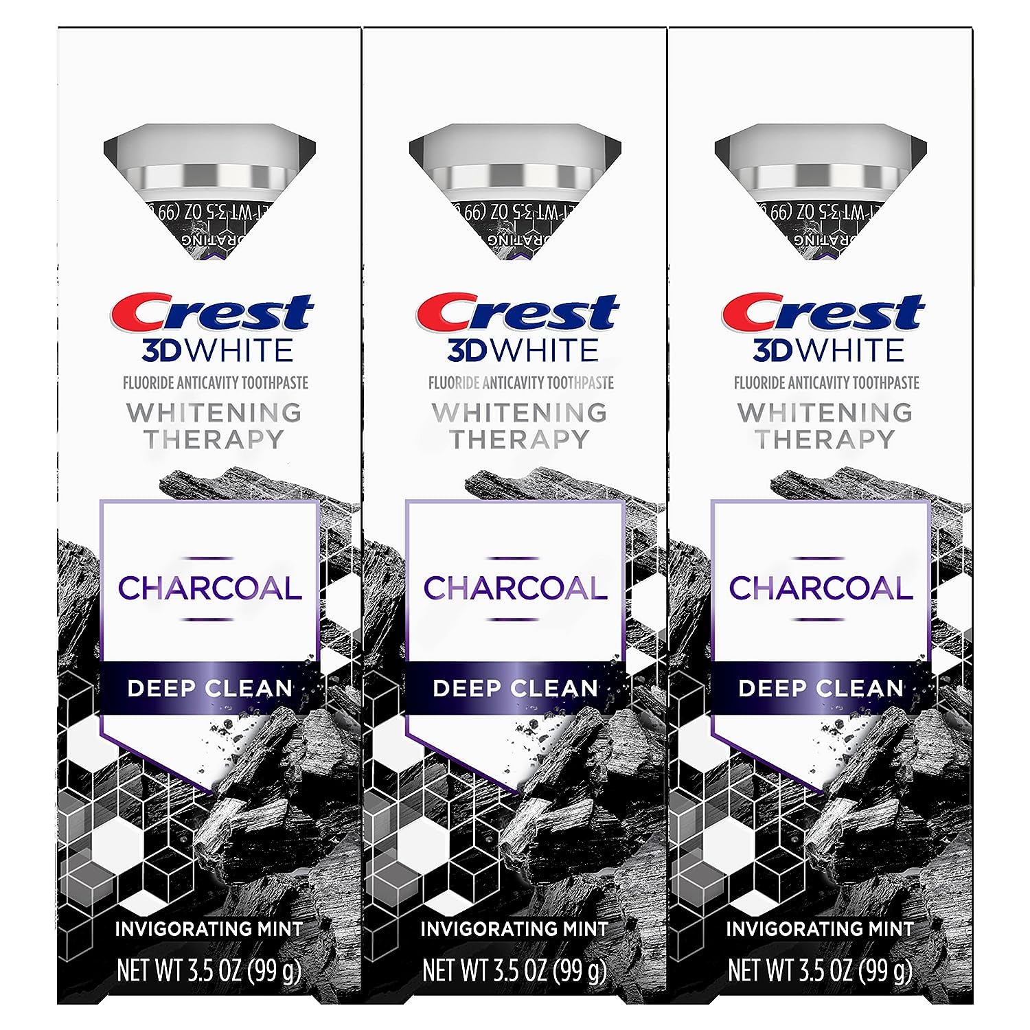 Product display of Crest 3D White Whitening Therapy Charcoal toothpaste 3-pack