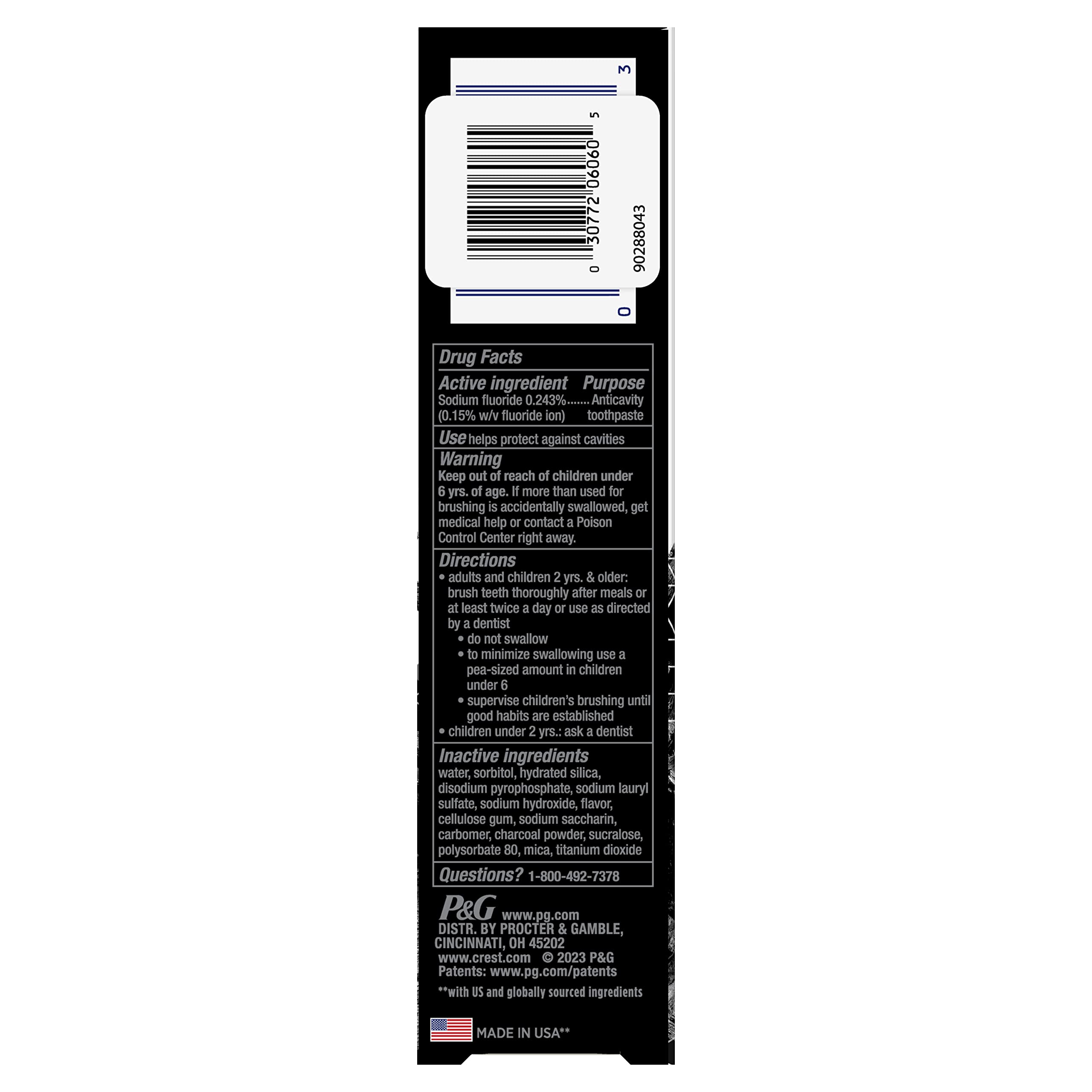 Toothbrush and Crest 3D White Whitening Therapy Charcoal toothpaste with mint flavor