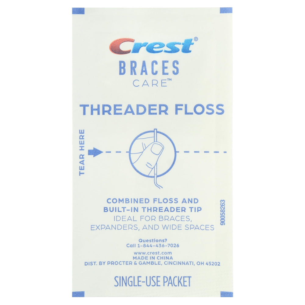 Plaque removal between teeth with Crest Braces Care Threader Floss