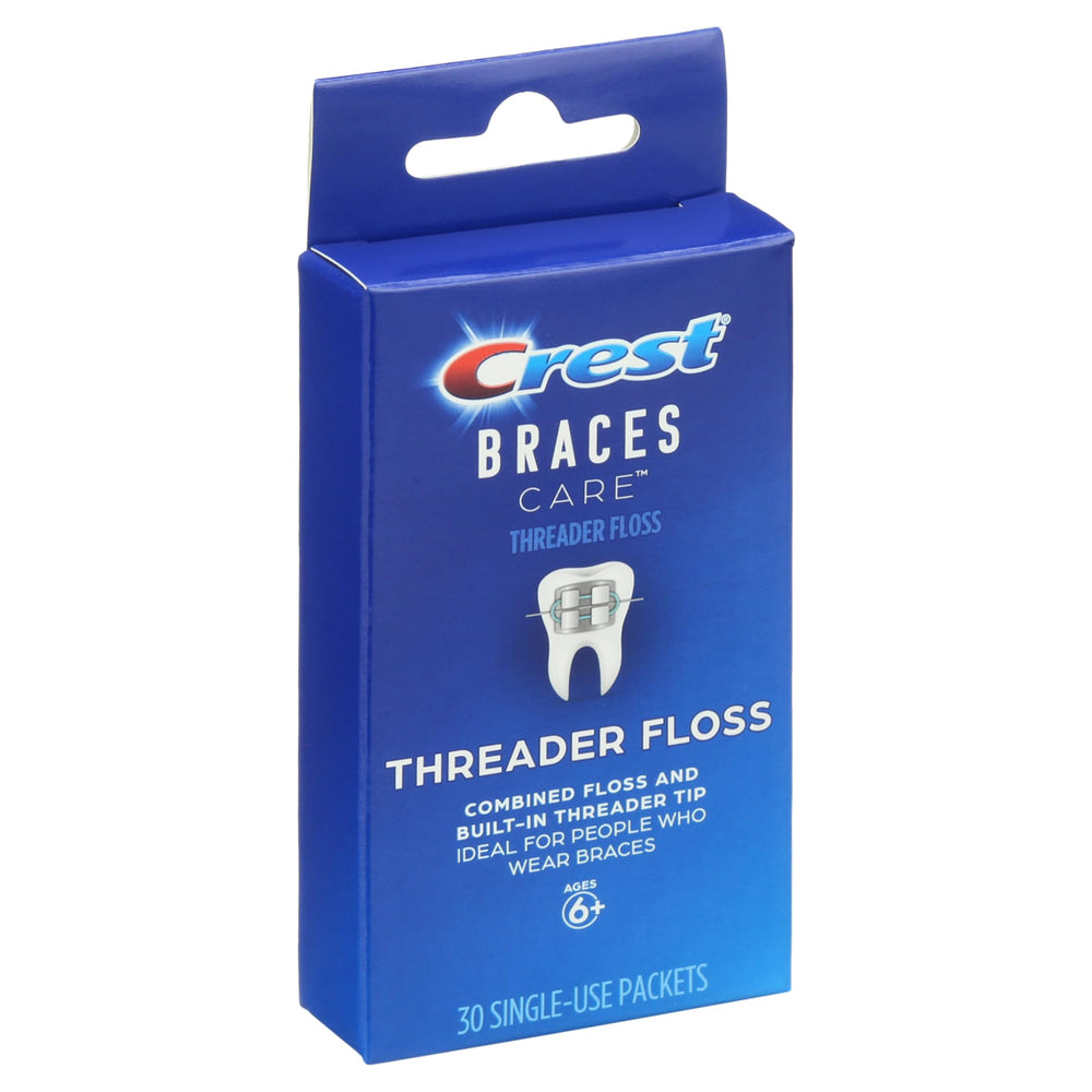 Floss being used under braces with built-in threader
