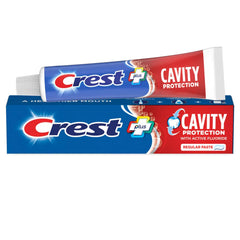 Three Crest Cavity Protection toothpaste tubes together