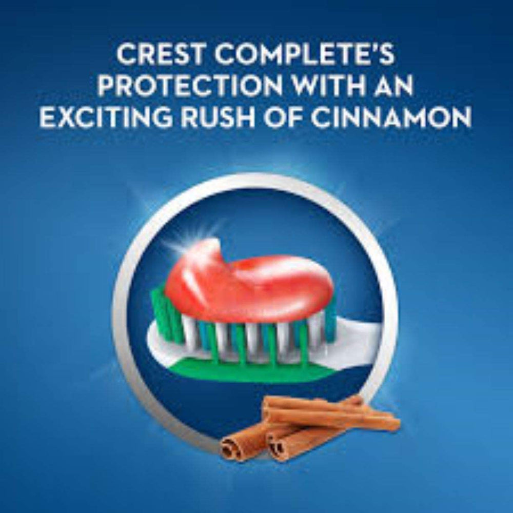 Toothpaste being squeezed onto toothbrush with cinnamon flavor