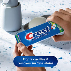 Toothpaste being dispensed onto toothbrush