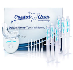 Crystal Clear Teeth Whitening Kit components: gel syringes, LED light, and mouth tray