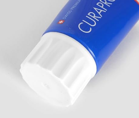 Child brushing teeth with strawberry-flavoured toothpaste