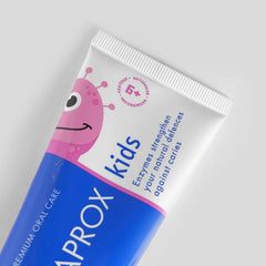 60ml toothpaste tube on white surface with cap off