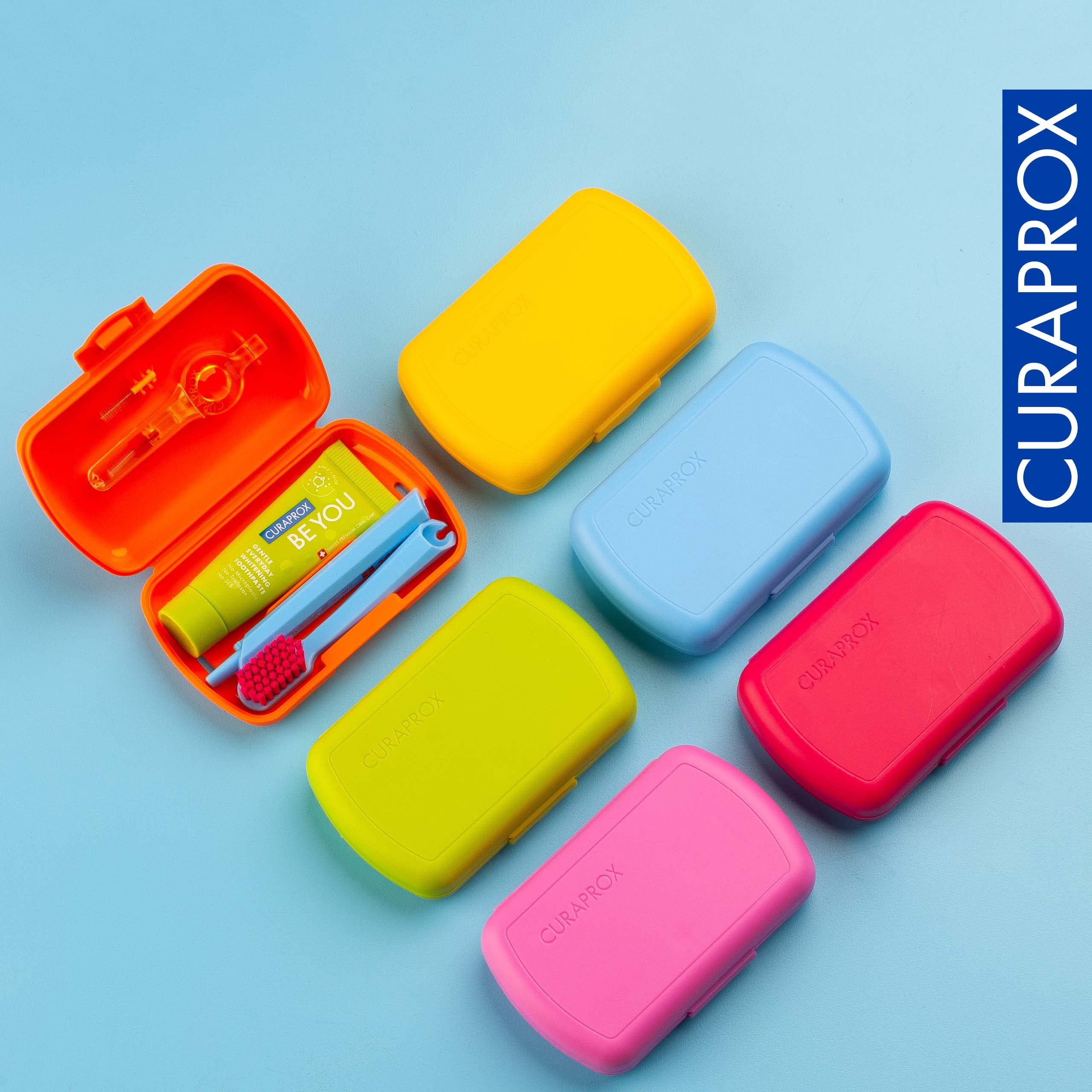 All items arranged in Curaprox Travel Kit Blue