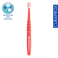 Detailed view of 0.06mm CUREN bristles on Curaprox toothbrush