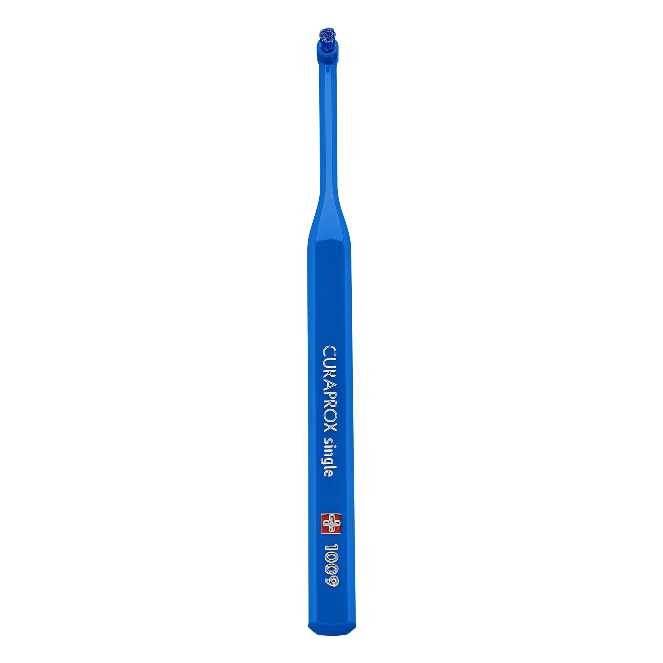 Close-up of Curaprox single-tuft toothbrush head with blue filaments