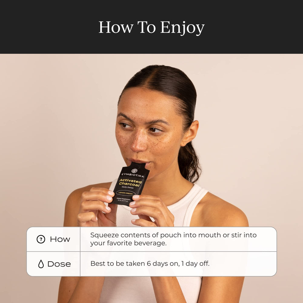 Activated charcoal powder and lemon cream essence close-up