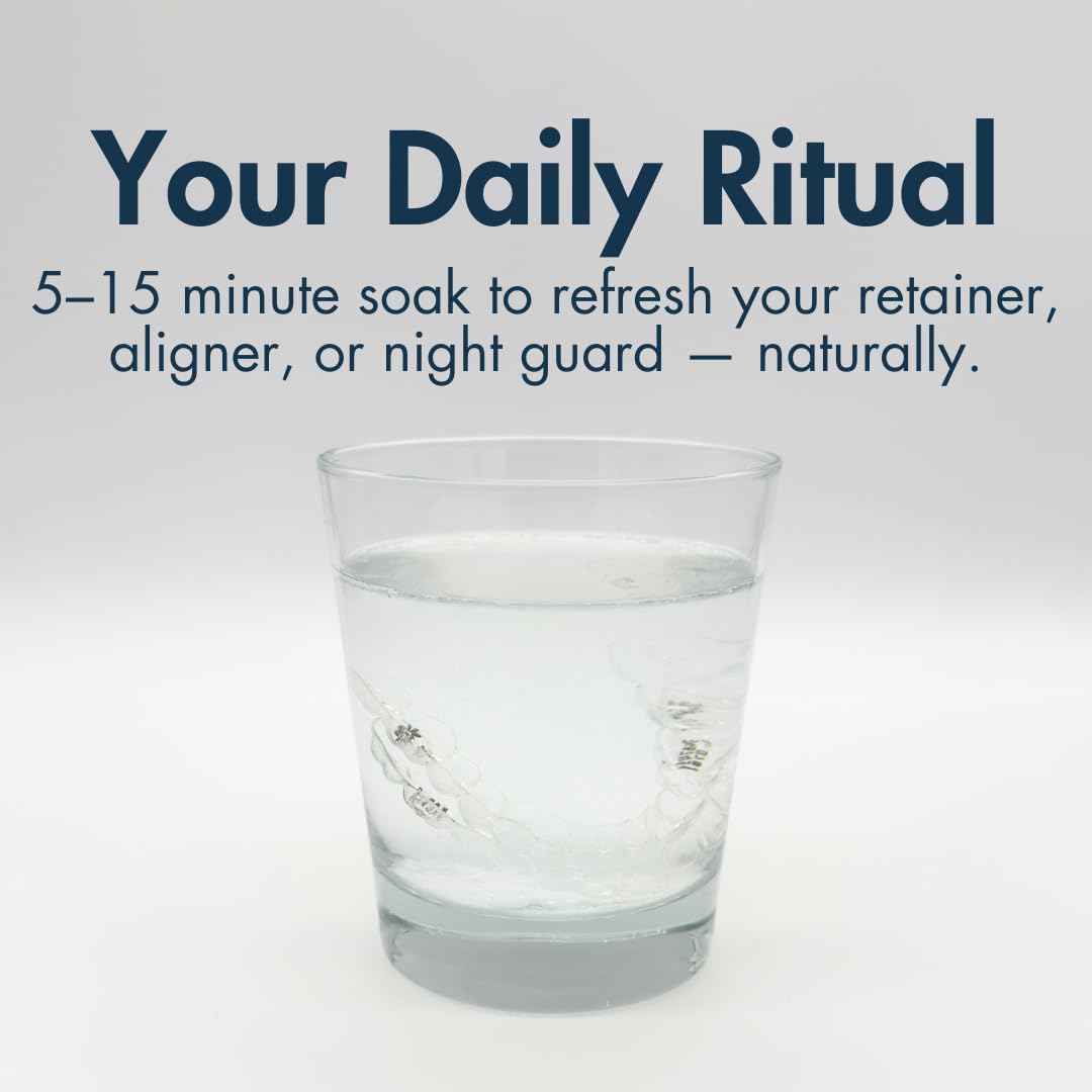 Dentures and mouthguards soaking during cleaning with The Daily Refresher