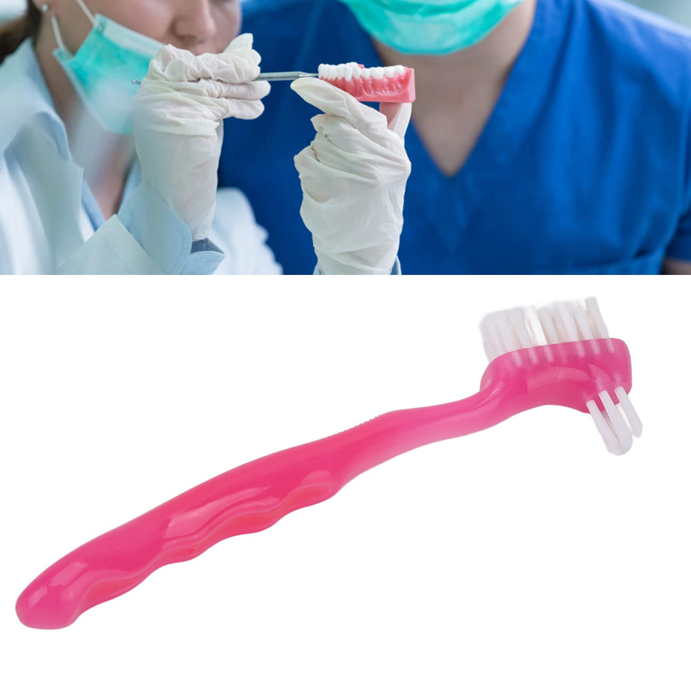 Pink denture brush designed for home and travel use