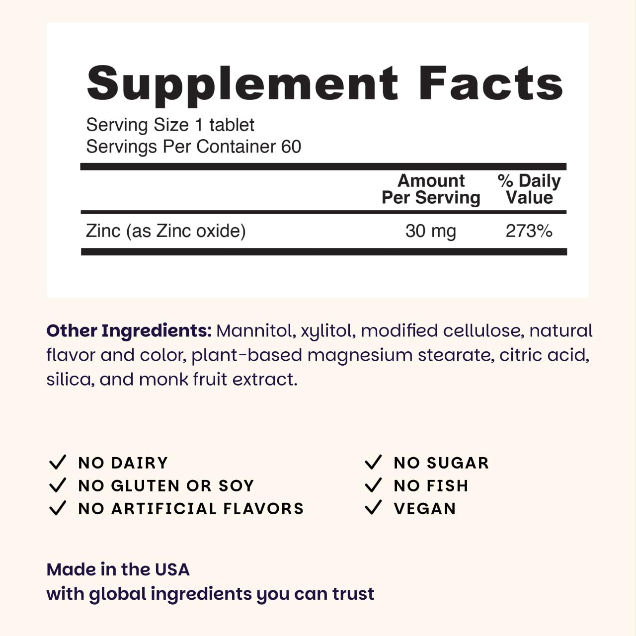 Dissolving blueberry-flavored zinc lozenge on tongue