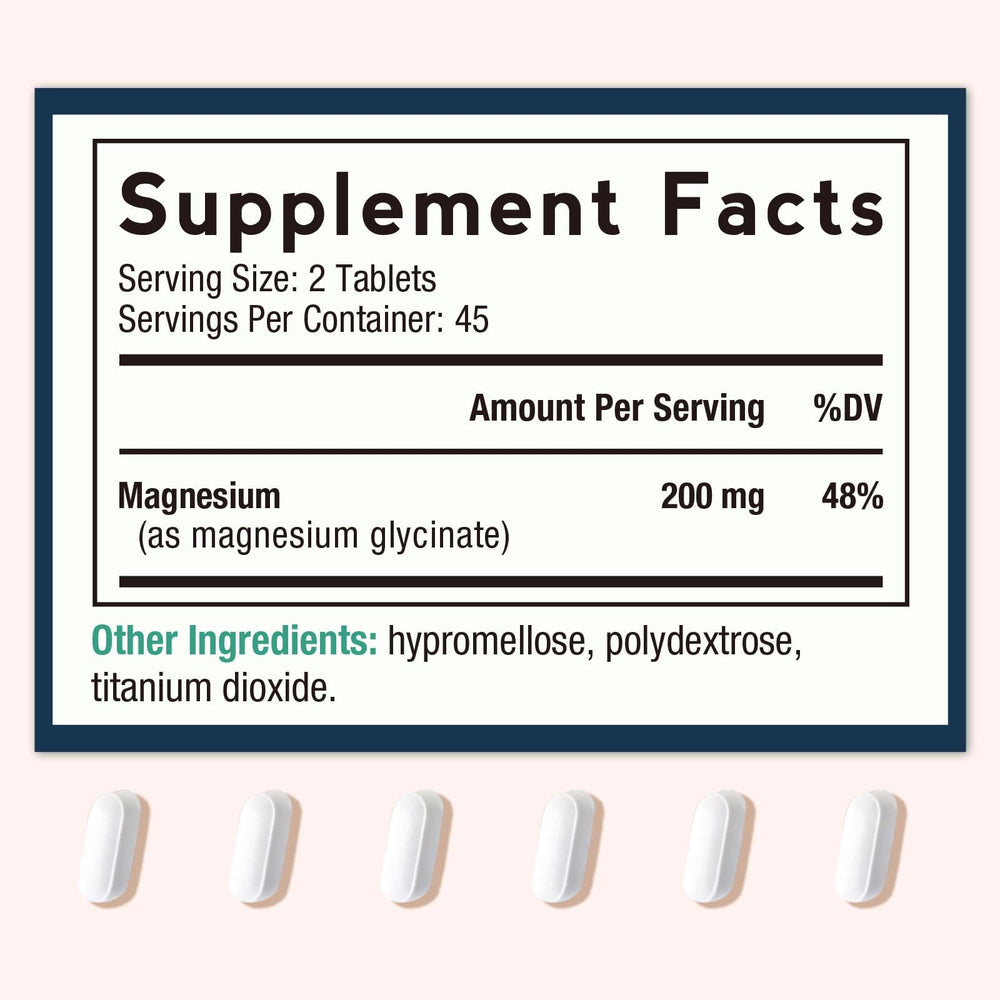 Close-up of magnesium glycinate tablets showing 200 mg per two tablets