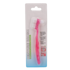 Double-sided denture cleaning brush with pink handle