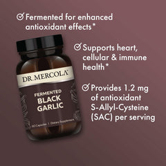Fermented Black Garlic capsules arranged with some capsules spilled