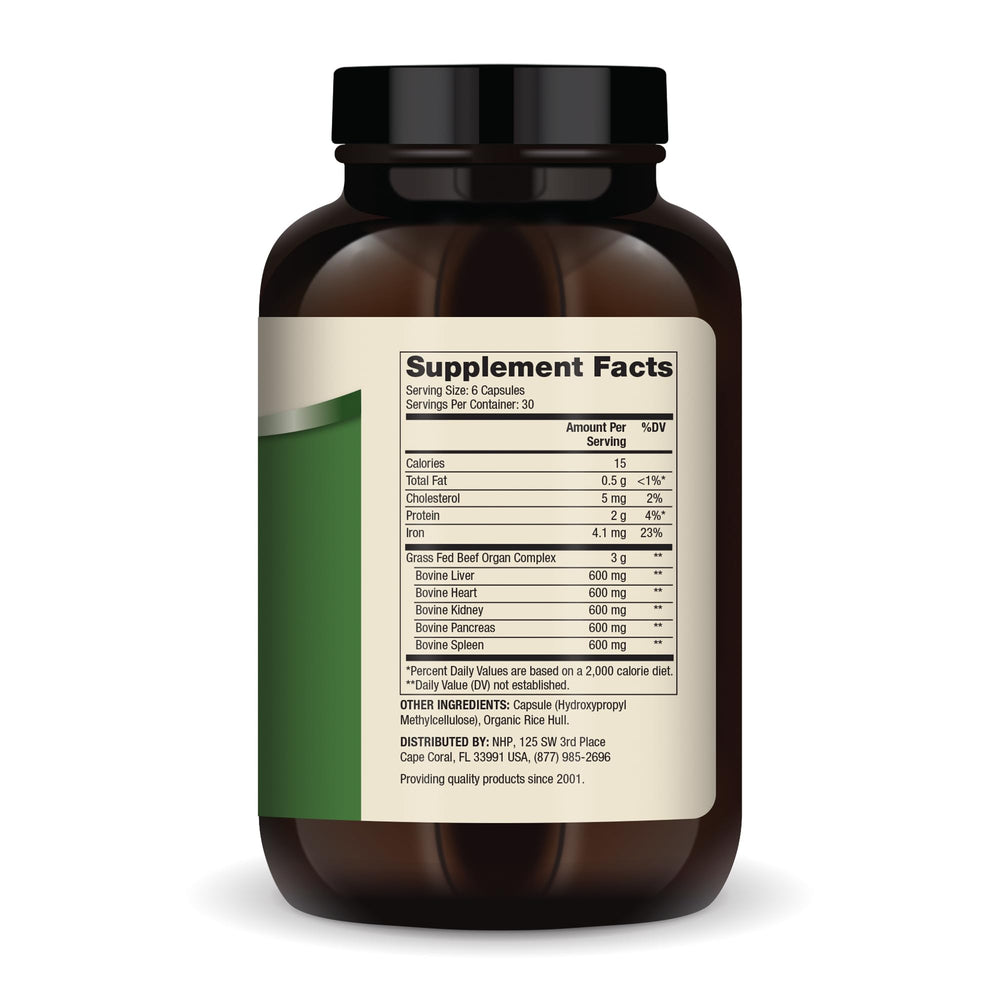 Close-up of Dr. Mercola Beef Organ Complex capsules arranged in a row.