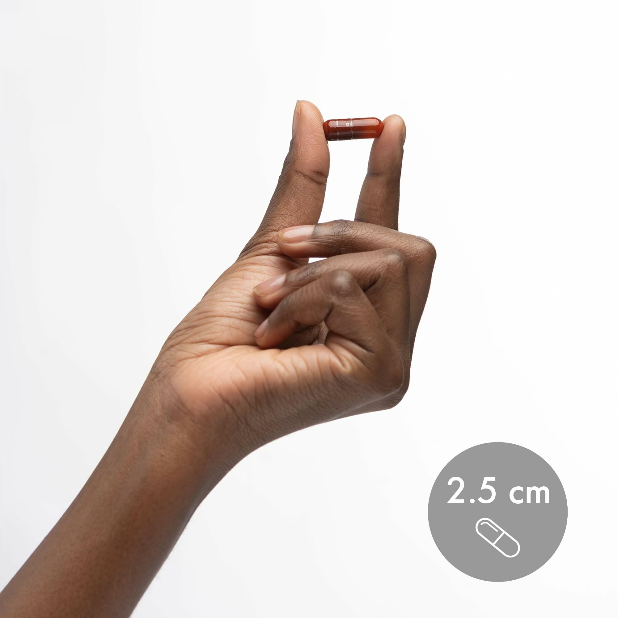 Bottle on a white background with capsules nearby