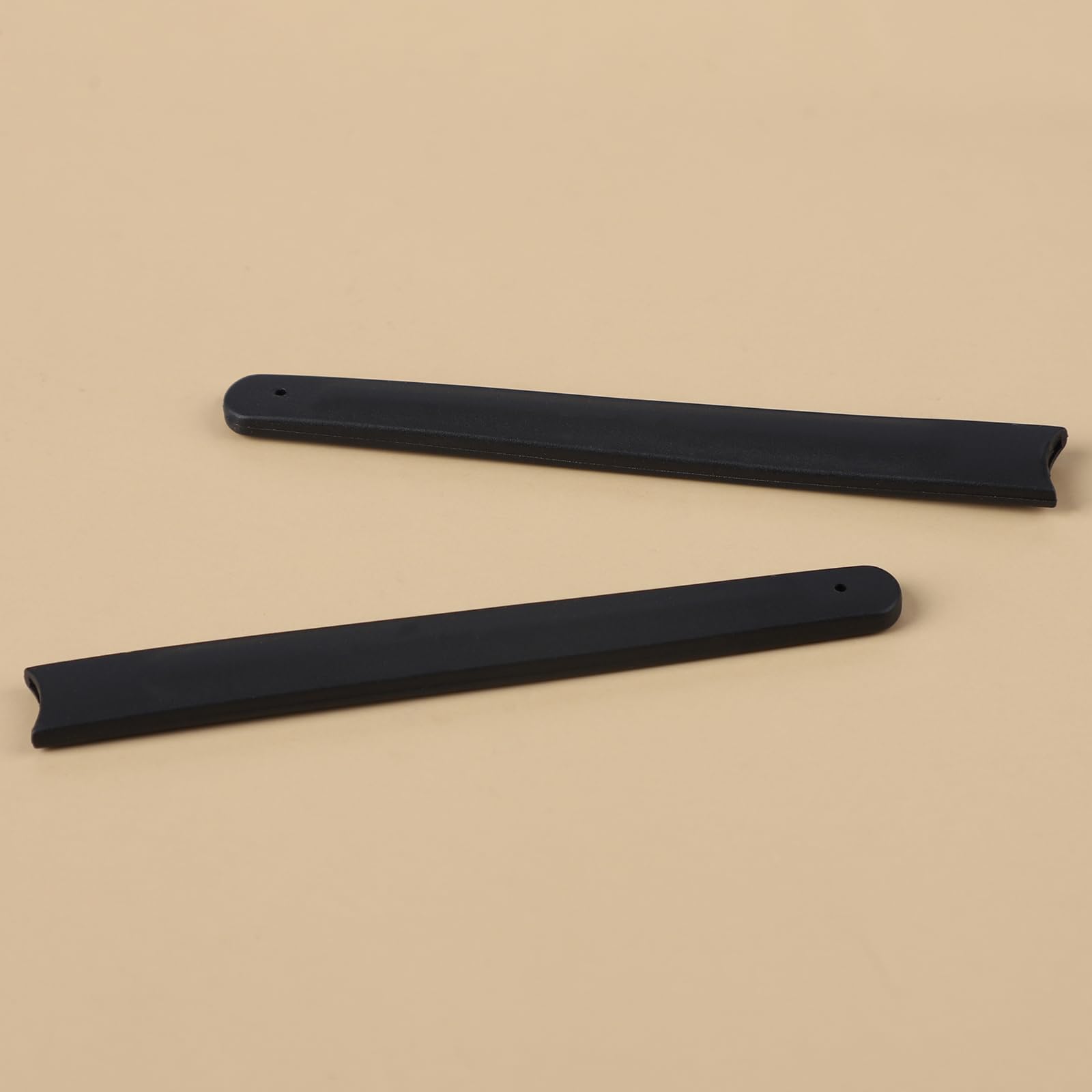 One pair of black earsocks displayed against white background