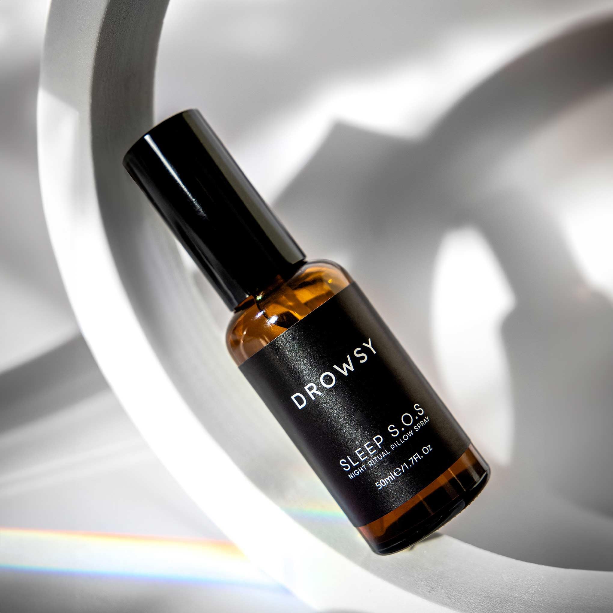 Close-up of DROWSY SOS Sleep Pillow Spray 50ml bottle