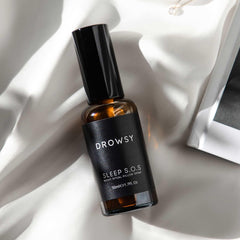 Nightstand with DROWSY SOS Sleep Pillow Spray by bedside