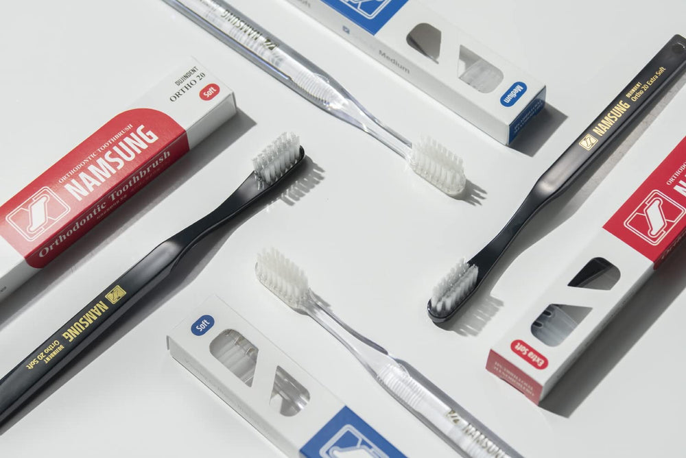 Ergonomic straight-handle PETG toothbrush in use