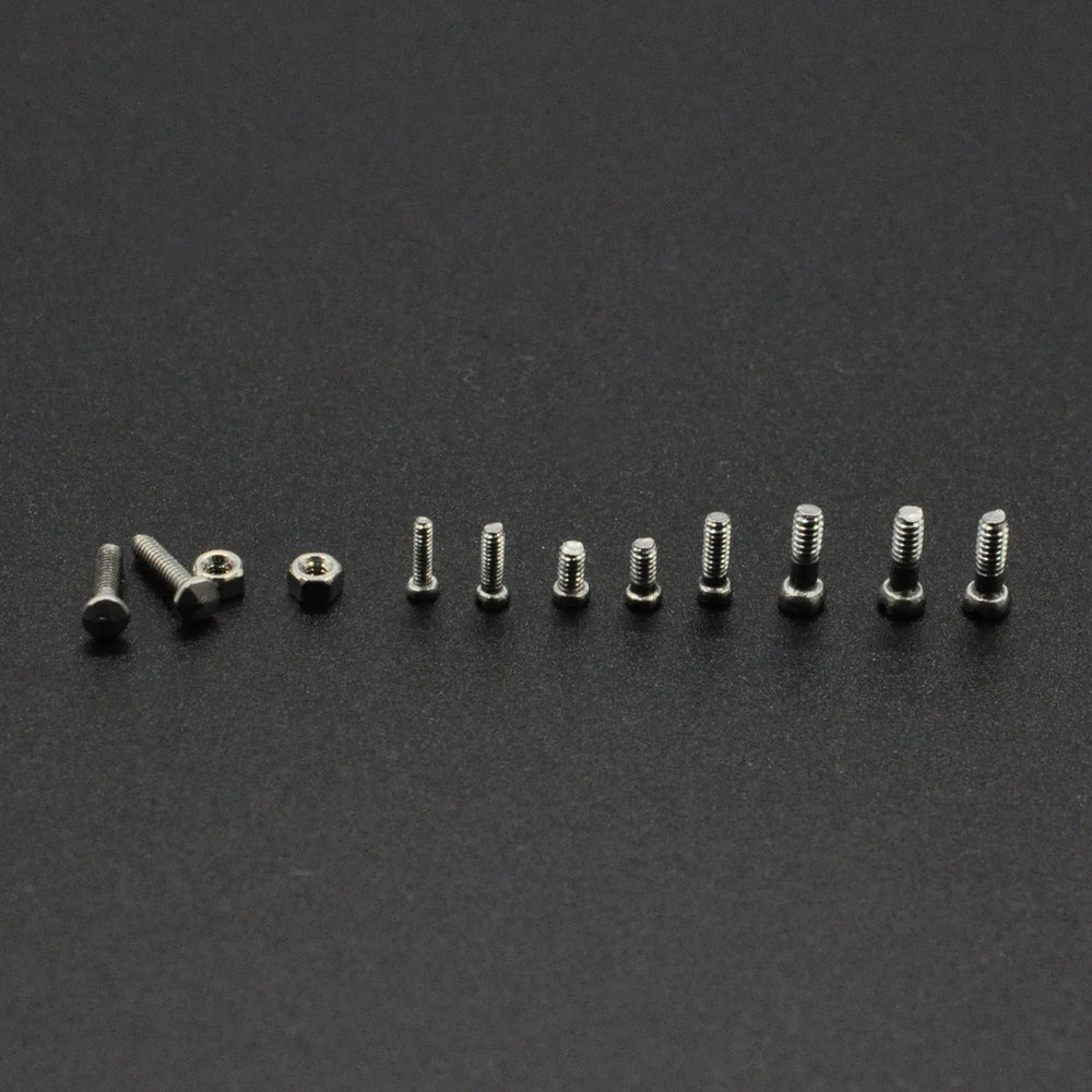 Close-up of micro screws and nuts in a transparent box