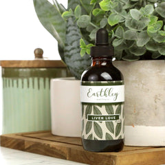 Earthley Wellness Liver Love dispensing spoon suggests easy dosing within daily routines.