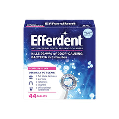 Dissolving Efferdent Complete Clean tablet in warm water