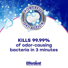 Dentures soaking in Efferdent Complete Clean solution