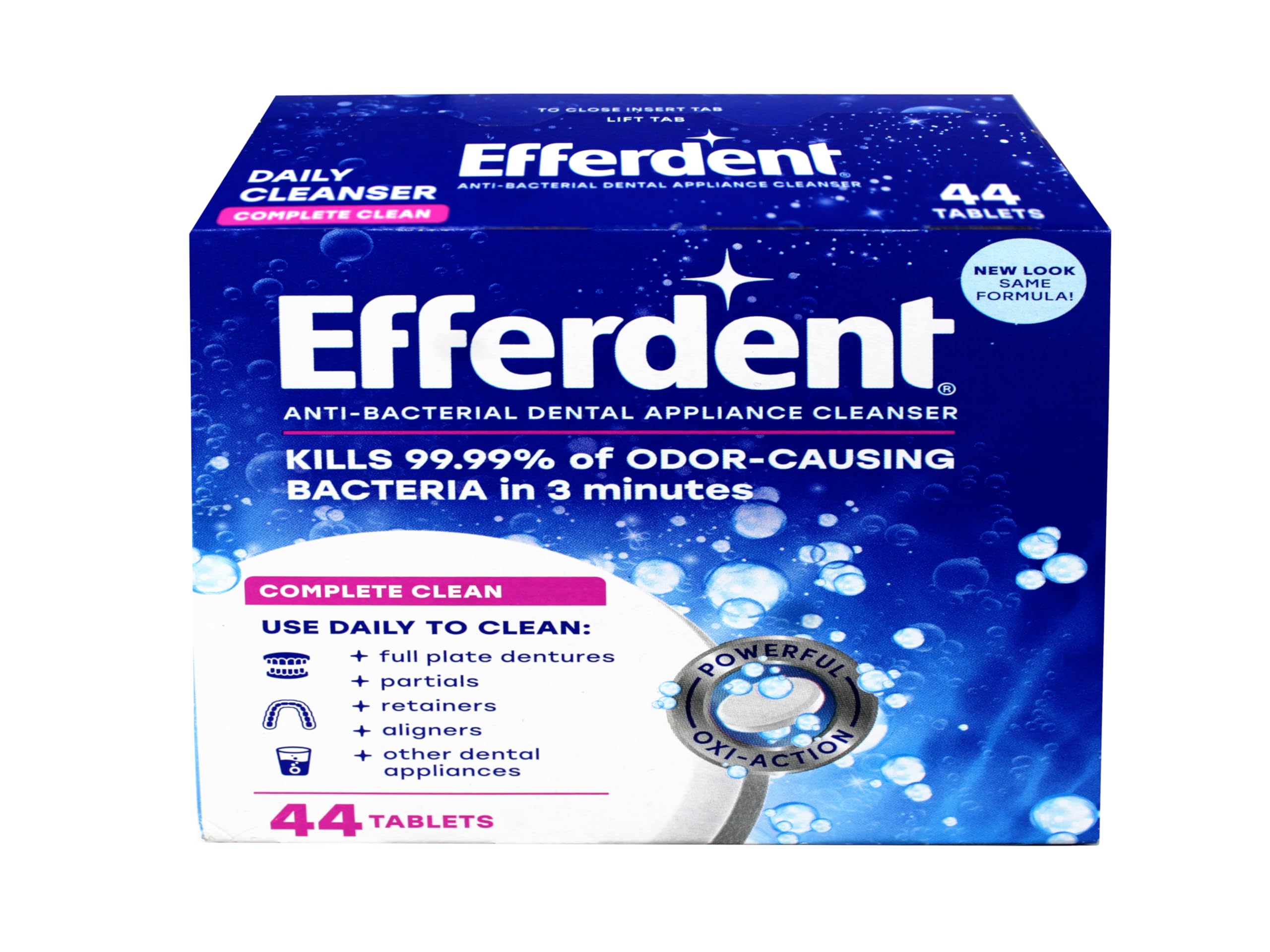 Close-up of Efferdent Complete Clean tablets dissolving in warm water
