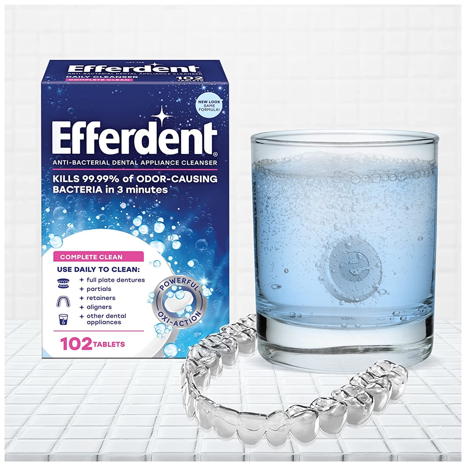 Efferdent tablet removing plaque and bacteria from dentures
