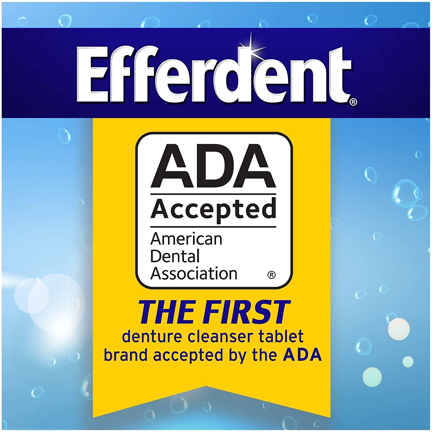 Hands cleaning dental appliances with Efferdent tablets