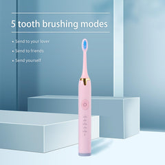 Electric toothbrush white and pink side view