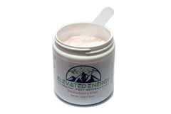 Serving scoop of Strawberry Kiwi powder being added to a glass.