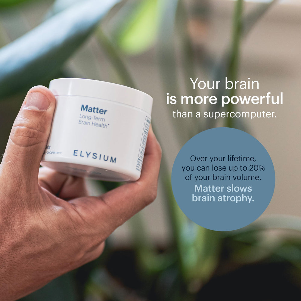 Lifestyle shot of ELYSIUM Matter on desk with notebook