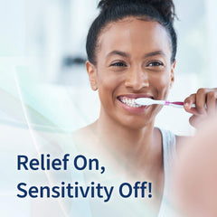 Mint Breeze Enamelon toothpaste tubes beside a glass of water