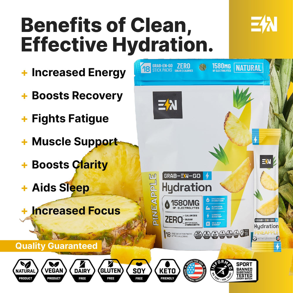 Engineered Nutrition pineapple electrolyte packet being scooped for on-the-go mixing.