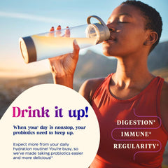 Probiotic drink mix being poured into a glass to show peach flavor