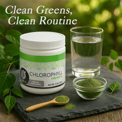 Scoop of chlorophyll powder poured into a glass of mint water