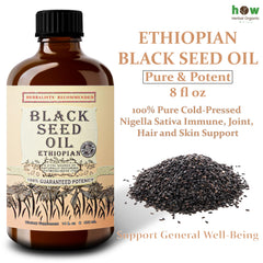 Pouring Ethiopian Black Seed Oil into a spoon
