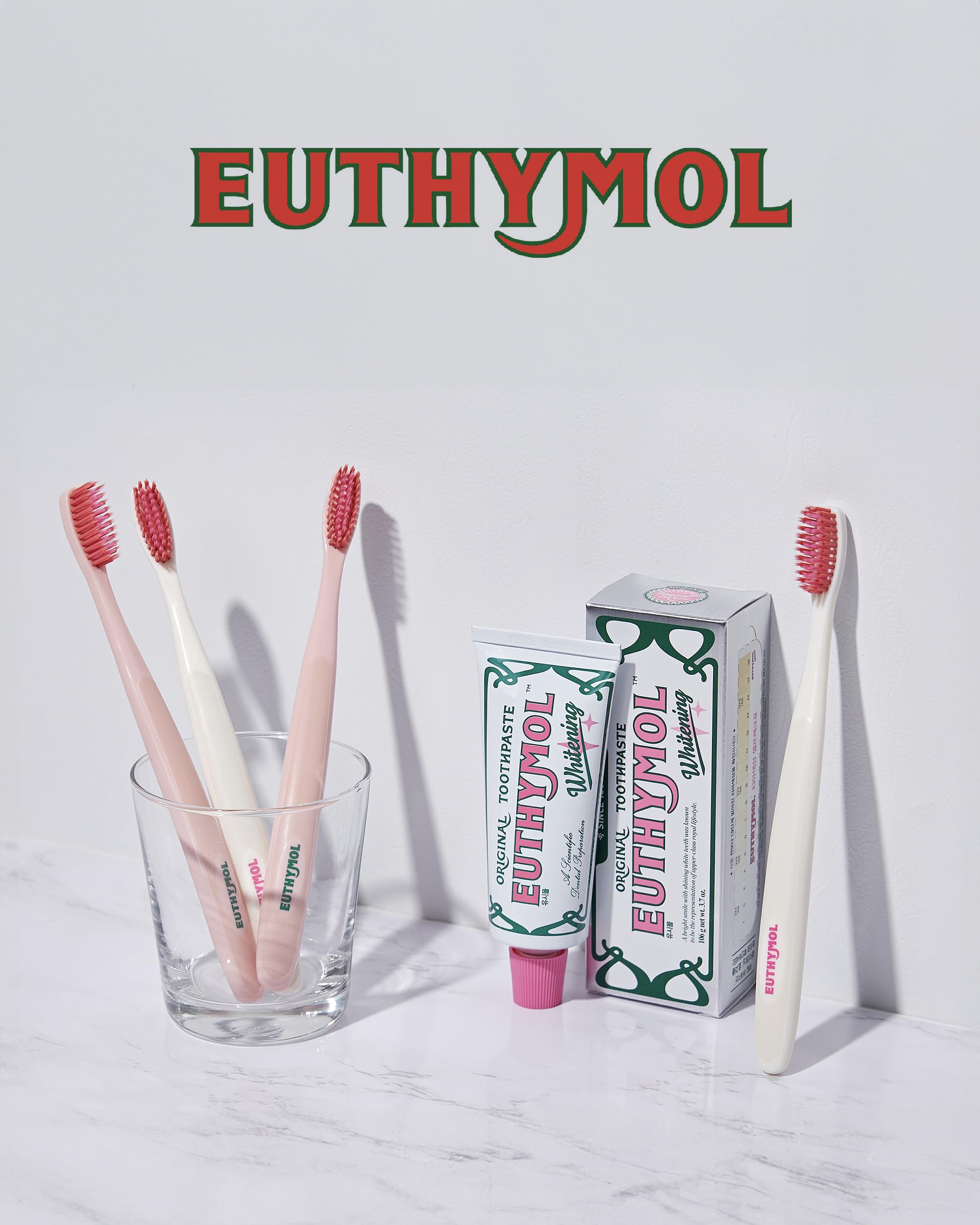 Euthymol branding on pink toothbrush with 6-pack count