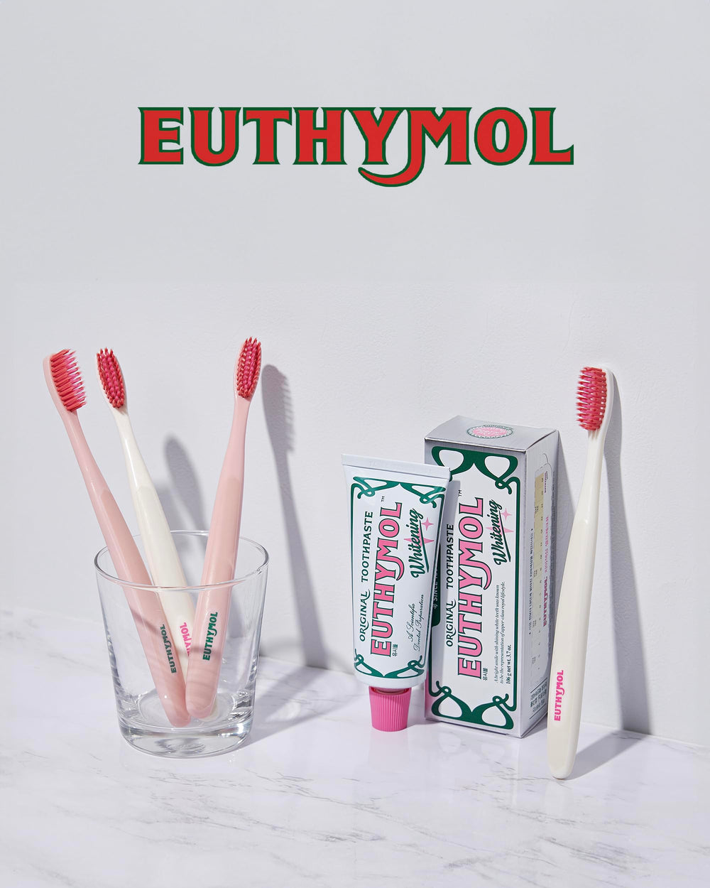Euthymol branding on pink toothbrush with 6-pack count
