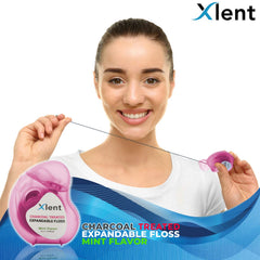 Close-up of floss expanding between teeth to reach plaque