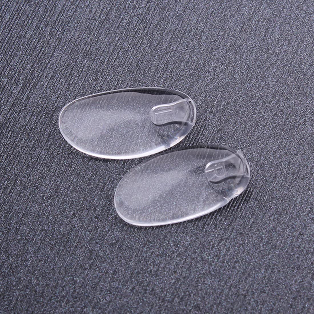 Plug-in eyeglass nose pads in clear silicone