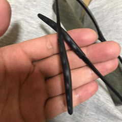 Black BEHLINE temple tips on glasses frame