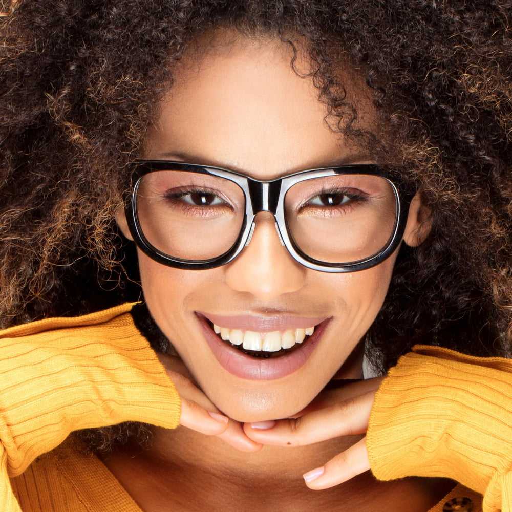 Glasses with transparent nose pads attached