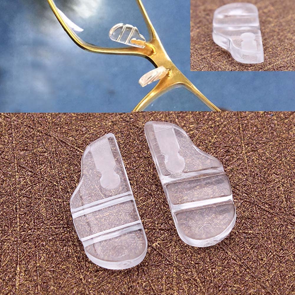 Two white semi-soft silicone nose pads for Tag Heuer eyewear, front view