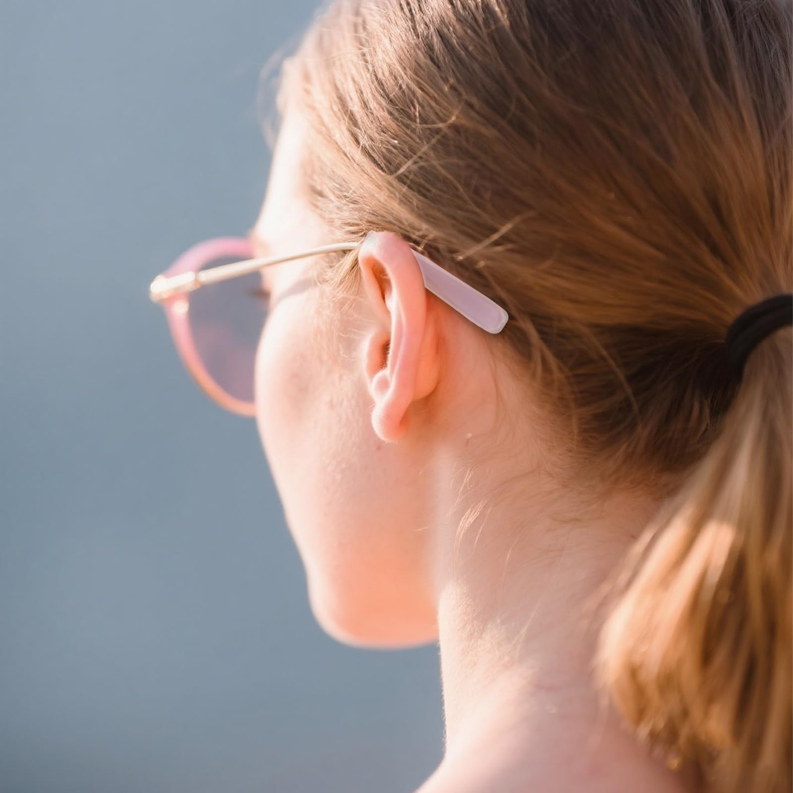 Transparent silicone ear grips for eyeglass temples